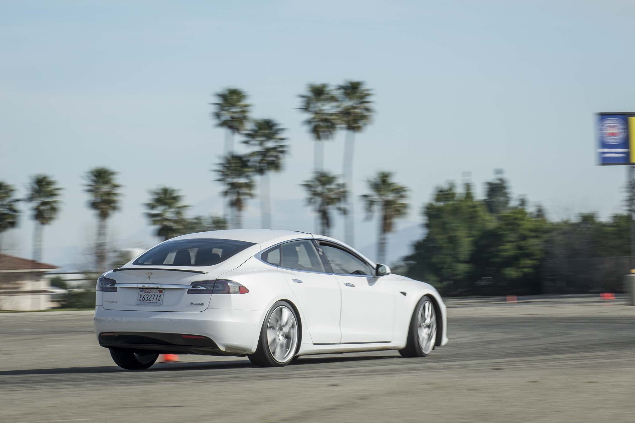 2017 Tesla Model S P100D rear three quarter in motion