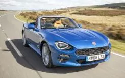 Fiat 124 Spider driving, roof down 